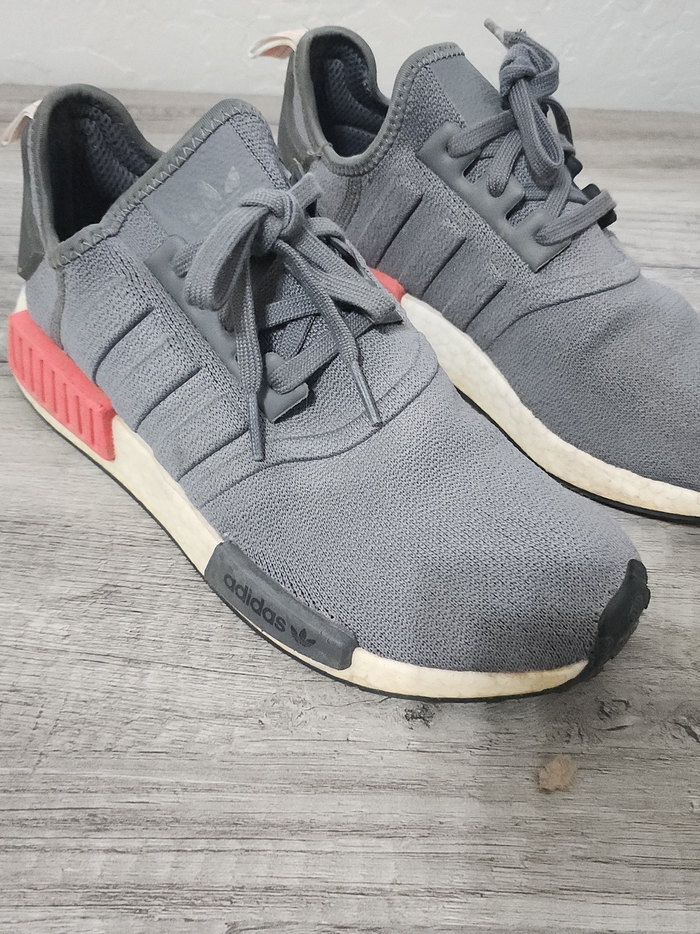 adidas Men’s Gray NMD_R1 Casual Sneaker with Red Accents